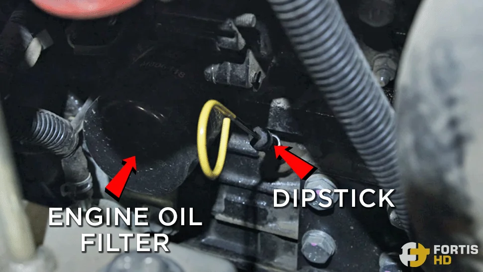 Overlay arrows show the location of the engine oil filter and the dipstick of the John Deere 17G Mini Excavator.