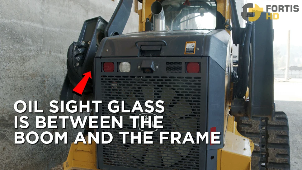 An arrow shows the location of the hydraulic oil sight glass on the 333G.